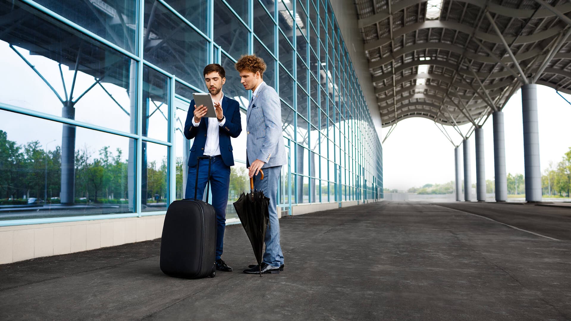 Travellers arriving at the airport terminal